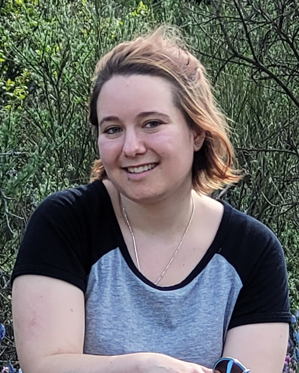 photo of Jessica MacVicar sitting in a field